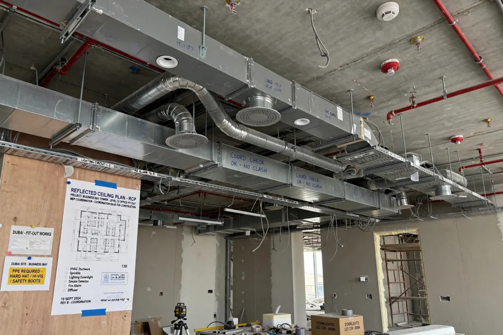 Commercial office fit-out in Dubai with glass partitions and modern workstations